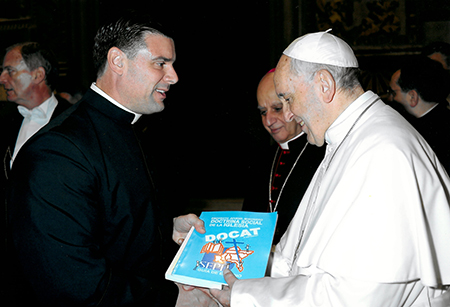 Father Rafael Capó, Southeast Pastoral Institute for Hispanics’ director handed Pope Francis three documents. Two were written by young Hispanics themselves: an Easter Book of reflections and a bilingual study guide on the DOCAT, the catechism for the youth of Catholic social doctrine. The third listed the conclusions of the Southeast Regional Encuentro held in Miami in February.