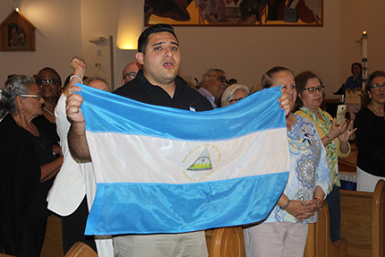 U.S.-born Juan Suárez, a parishioner at St. John Bosco in Miami who was relatives in Nicaragua, takes part in the Mass urging peace, freedom and justice in the country.