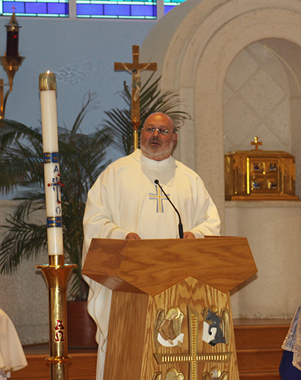 Father Marcos Somarriba, pastor of St. Agatha Church in Miami, urges support for the young people fighting for a free Nicaragua during his homily at the Mass.