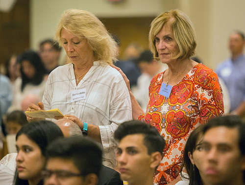 Sponsor Georgia Maklaklewicz, right, puts her hand on the shoulder of Barbara Anne Taylor, candidate, during the second of two Rite of Reception ceremonies April 29 at St. Mary Cathedral. The Rite of Reception takes place on a Sunday after Easter to welcome new Catholics - those who were baptized into a Christian church or the Catholic Church but have yet to receive all the sacraments of initiation - into full communion with the Church.