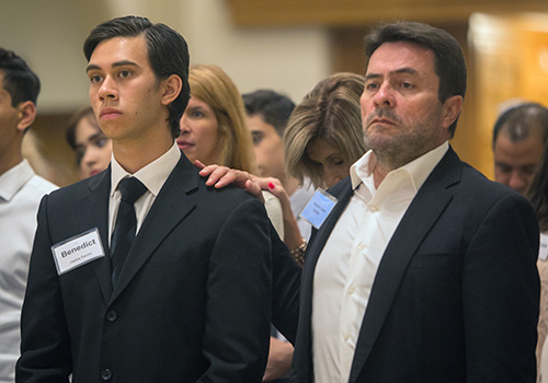 Antonio Jose Vallejo, sponsor, puts his hand on shoulder of Carlos Faccin, candidate, during the second of two Rite of Reception ceremonies April 29 at St. Mary Cathedral.