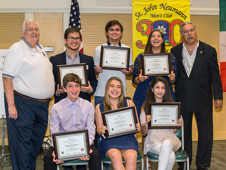 Dan Lamey, left, St. John Neumann Men's Club president, and Eric Schwindeman, chair of the group's merit scholarships committee, pose for a photo with the first scholarship winners. Back from left: Diego Guerrero, 18, Gregory Mesa, 18, Alyssa Bell, 18; front, from left: Gabriel Taboro, 15, Daniela Hoyos, 13, and Lauren Morera, 14.