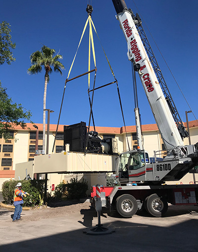 Crews hoist a massive generator into place at one of Catholic Health Services' medical facilities. All CHS nursing homes, rehabilitation hospitals and assisted living facilities are now equipped with the commercial grade, customized generators.
