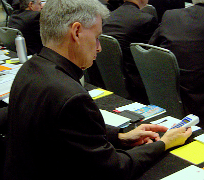 A bishop uses an electronic keypad to vote during the semiannual meeting of the United States Conference of Catholic Bishops, this week in Fort Lauderdale.