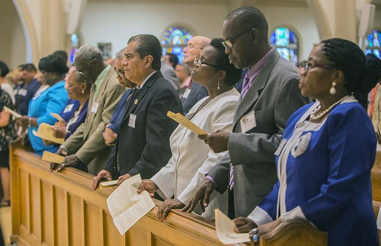 Lay ministers pray during the commissioning Mass, June 9 at St. Mary Cathedral.