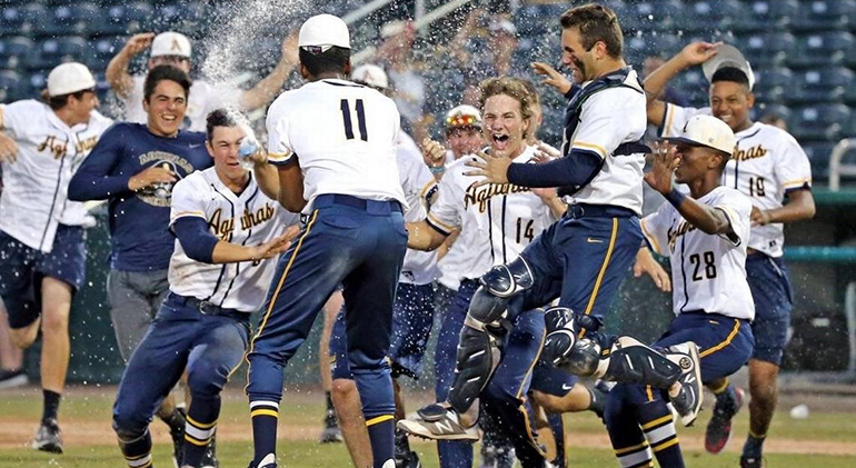 St. Thomas Aquinas High School's baseball players celebrate their 8-4 victory over Sarasota to claim their first state championship since 2003. The team ended the season with a 27-3 record.