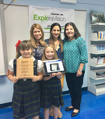 St. Thomas the Apostle School third graders Alana Fernandez, left, and Katy Elgarresta stand with (from left) principal Lisa Figueredo, science teacher Caridad Carbonell and language arts teacher Carmen Garcia. The girls won second place in the nation for their Smart Toilet in the 26th annual ExploraVision science competition sponsored by Toshiba and the National Science Teachers Association.