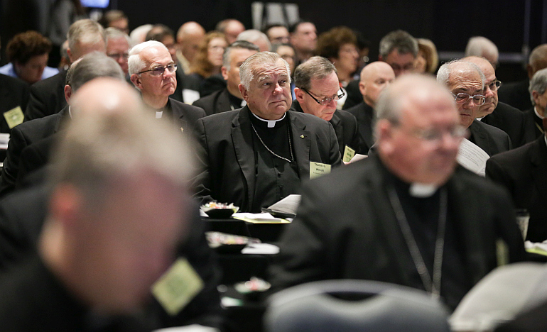 Archbishop Thomas Wenski sits in on a session at the spring meeting of the United States Conference of Catholic Bishops in Fort Lauderdale.