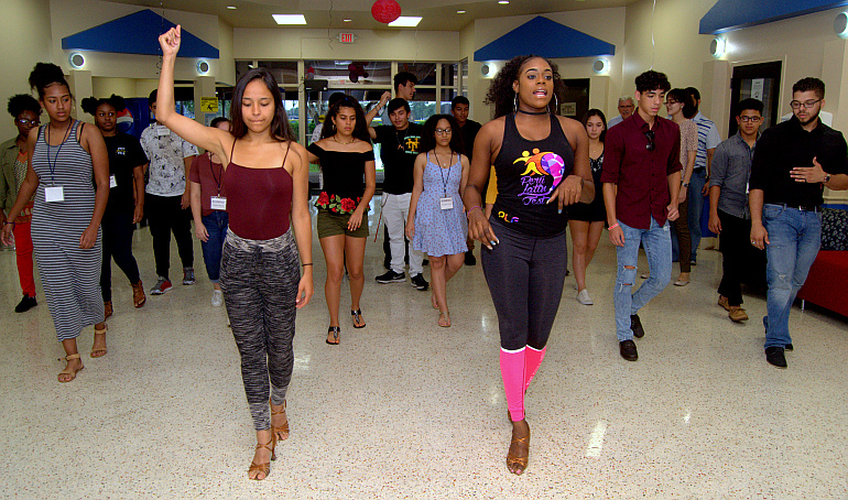 A multicultural festival finished up STU Impact week at St. Thomas University. Teaching salsa dance are Rebecca Sagarnaga, left, and Stella Azerot.