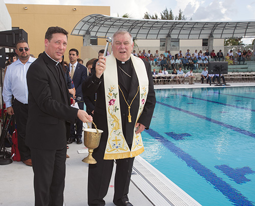 Archbishop Thomas Wenski blesses Belen Jesuit's new Gian Zumpano Aquatic Center.