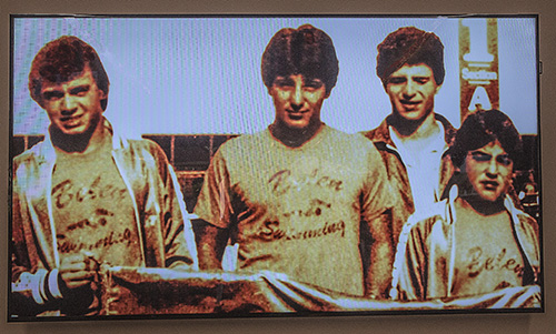 A photo from the 1980s of Belen swimmers Jorge Baste, Gian Zumpano, Joe Zumpano and Henry Artalejo, seen during a video presented at the dedication of Belen Jesuit's new Gian Zumpano Aquatic Center.