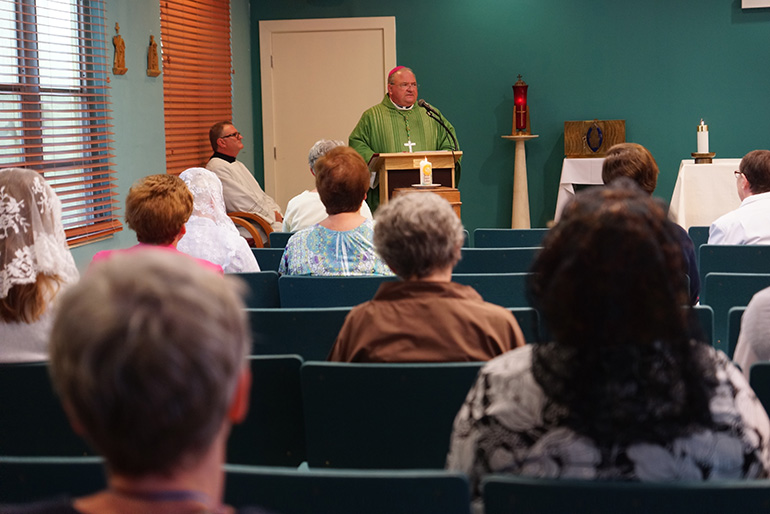 Miami Auxiliary Bishop Peter Baldacchino preaches the homily at the closing Mass July 10 of the U.S. Convocacation of Consecrated Virgins, celebrated at MorningStar Renewal Center in Pinecrest.