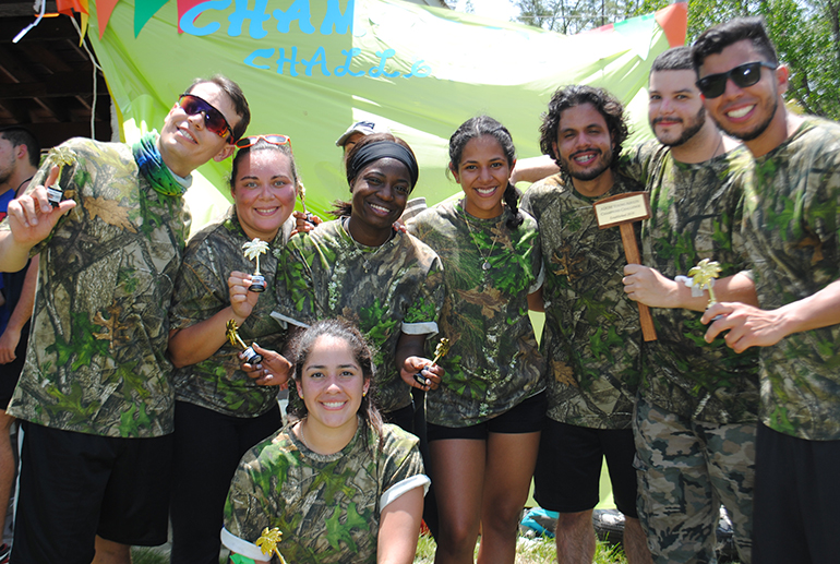 The winning Camo Team pose with their trophies and prize. From left: Jesus Valentino, Yamileth Ayala, Rachel Mpanu, Gaby Soto, Jorge Jimenez, Brian Fernandez, Carlos Rodriguez and Tania Aranacano. One-hundred sixty young adults from throughout the Archdiocese of Miami, divided into co-ed teams with eight members each, took part in the first Champions Challenge, an afternoon of fun and field games that also doubled as an opportunity for fellowship and evangelization. The event took place July 21, 2018 at Tropical Park in Miami.