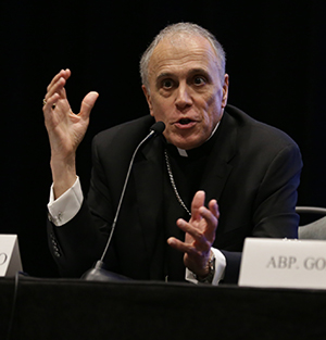 Cardinal Daniel DiNardo of Houston, president of the U.S. bishops’ conference, answers reporters' questions during the U.S. bishops' meeting in Fort Lauderdale, June 13-15, 2018.