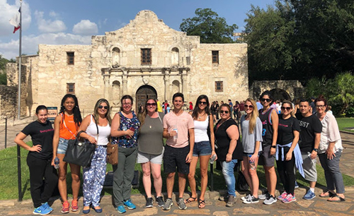 St. Thomas Law team of students, professors and mental health experts pose for a photo during their time in Texas.