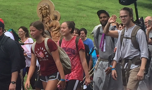 A group of walking pilgrims carry an icon of Poland's patroness as they arrive at the American Czestochowa in Doylestown, Pennsylvania, Aug. 12.
