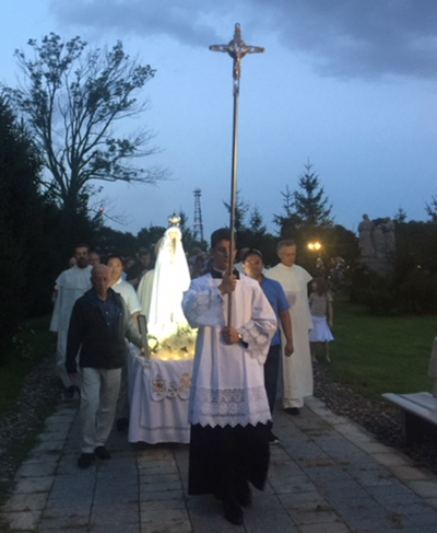 Participants carry an image of Our Lady of Fatima during a nighttime procession Aug. 13 at the Shrine of Our Lady of Czestochowa in Doylestown, Pennsylvania.