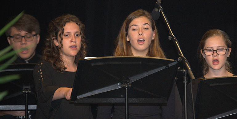 St. Thomas Aquinas High School choir sings during the back-to-school conference for archdiocesan educators.