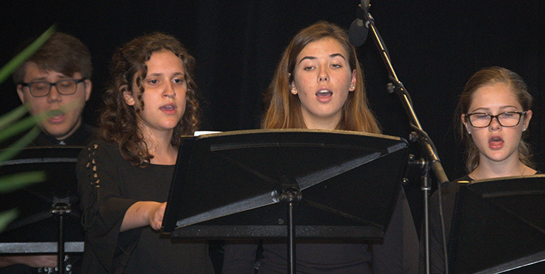 St. Thomas Aquinas High School choir sings during the back-to-school conference for archdiocesan educators.