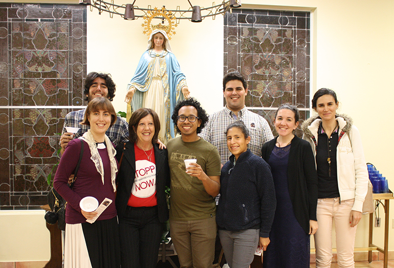 Members of the Latin Mass young adult community pose with Janet Colbert (second from left) after the Feb. 2 Mass at Mision La Milagrosa in Miami; front, from left: Francesca Hunter, Jose Ballon, Kelly Vargas, Emily Mangiaracina, Tatiana Talamas; rear left, Matthew Gutierrez; rear right, Anthony Garcia.