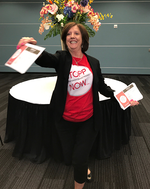 Opioid activist and STOPPNow author Janet Colbert hands out flyers at the Broward County Opioid Epidemic Town Hall Meeting in August 2017.
Colbert, a St. David's parishioner and retired neonatal intensive care nurse, championed the cause to end the opioid epidemic and founded STOPPNow in 2011 in response to the drug addicted babies she was caring for at Joe DiMaggio Children's Hospital.