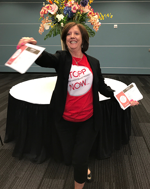 Opioid activist and STOPPNow author Janet Colbert hands out flyers at the Broward County Opioid Epidemic Town Hall Meeting in August 2017. 

Colbert, a St. David's parishioner and retired neonatal intensive care nurse, championed the cause to end the opioid epidemic and founded STOPPNow in 2011 in response to the drug addicted babies she was caring for at Joe DiMaggio Children's Hospital.