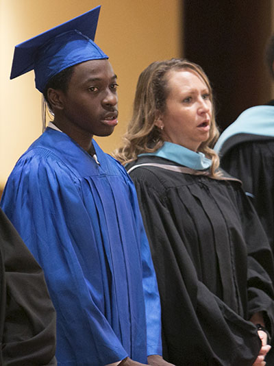 Marcie Ayers, coordinator of Special Programs for the archdiocesan Office of Schools, is pictured here at the July 2018 graduation of Samuel Ambroise, the first Miami graduate of the Archdiocese of Miami Virtual School. Ayers was his virtual school teacher.