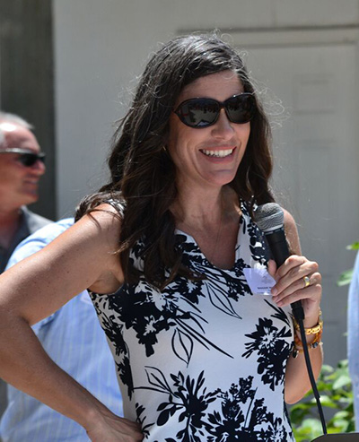 Maggie Whitcomb, founder of the Florida Keys Community Land Trust, speaks at the dedication of the first of four Keys Cottages, permanent, affordable housing for workers in the Keys, this past August.