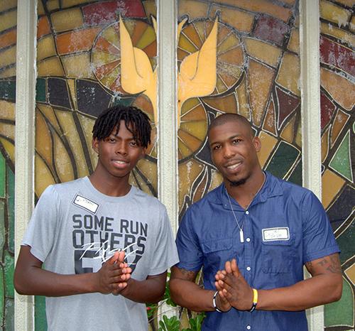 Jordan Cox Alexander, left, and Emery Davis grew up at St. George Church. They joined about 60-70 other former members Aug. 19 to celebrate parish life before the building's planned demolition.