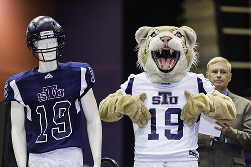 St. Thomas University's Bobcat mascot shows off the uniforms for the archdiocesan university's new football team, which will take the field in 2019. The Bobcats will play in the Mid-South Conference of the National Association of Intercollegiate Athletics.
