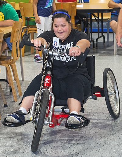 The Marian Center's Ashley Acoccella tries out the cycle.