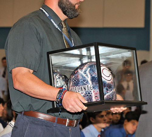 This motorcycle helmet bearing Christopher Columbus High School's "Adelante" motto was presented to Archbishop Thomas Wenski at the all-school Mass Aug. 30 marking the start of the 60th school year at the Marist Brothers' school in Miami.