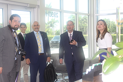 Aimee Viana, executive director of the White House Initiative on Educational Excellence for Hispanics, visited St. Brendan High, her alma mater, to highlight its innovative educational programs and accompanying infrastructure. With her, from left, are Emmanuel Caudillo, special adviser to the Hispanic Initiative, and Alberto Betancourt, communications adviser to the U.S. Department of Education. Also pictured: Guillermo Ramos, assistant principal, and at rear, Justin Prats, a senior in the STEM Academy.