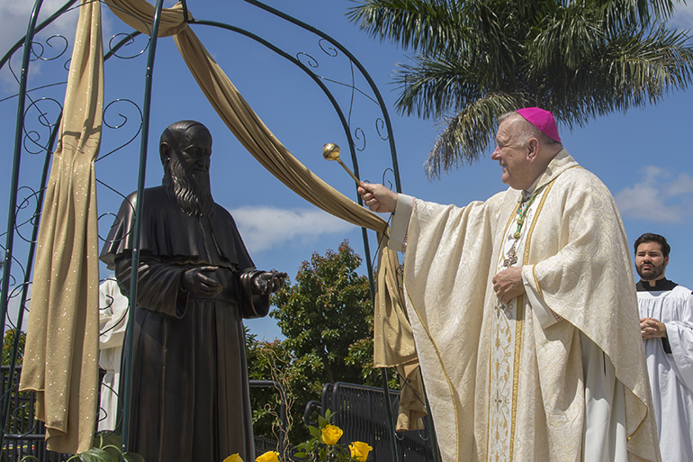 Archbishop Thomas Wenski blesses the statue of Father Joseph Kentenich at the Schoenstatt Shrine in Homestead. Father Kentenich founded the Schoenstatt Apostolic Movement over 100 years ago.