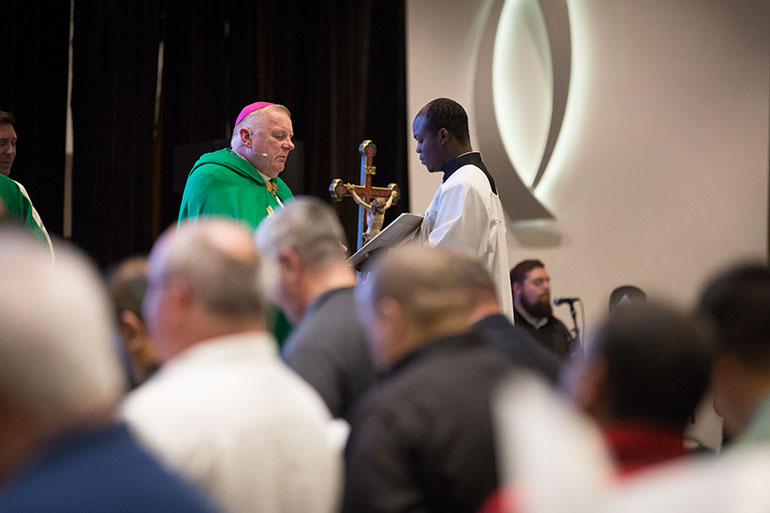 Miami Archbishop Thomas Wenski leads evening prayers Sept. 18 at the opening of an annual clergy convocation being held at the Hilton Miami Downtown hotel for several hundred priests of the archdiocese. The event, scheduled to conclude Sept. 20, included guest speakers, workshops and opportunities for spiritual and fraternal renewal among local clergy.