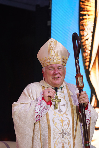 Archbishop Thomas Wenski says some closing words after celebrating the annual Mass on the feast of Our Lady of Mercy, Sept. 24, on the grounds of Mercy Hospital in Miami.