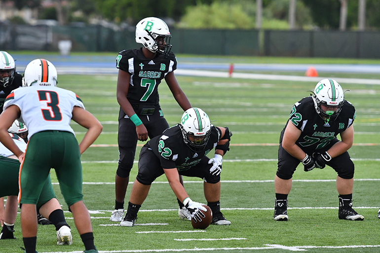 Sabres' freshman quarterback Khalil Anglin (#7) lines up for a snap during St. Brendan High's first varsity football game in the school's  43-year history. St. Brendan won its opening game versus Pinecrest 28-0.