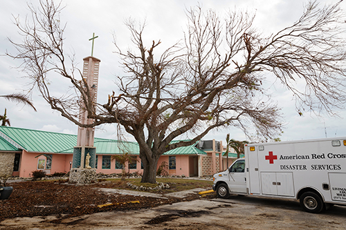 An American Red Cross vehicle is parked among the debris last year at the Miami archdiocesan church most devastated by Hurricane Irma, St. Peter the Fisherman in Big Pine Key.