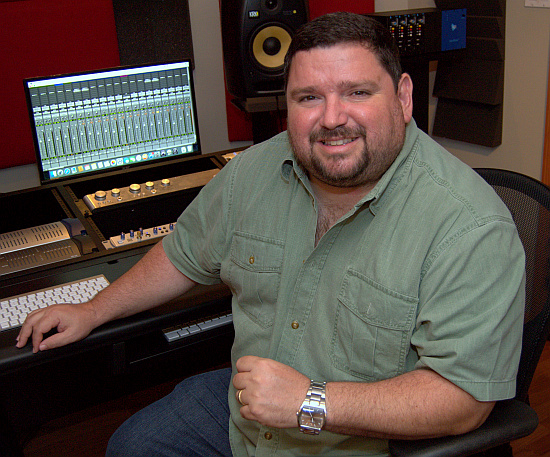 Juan Delgado shows the control board of his home studio in Miami. His company, Pristine Music, also produces for other Catholic artists.