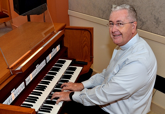 Msgr. Terence Hogan, dean of theology at St. Thomas University, has taught music and even plays organ.