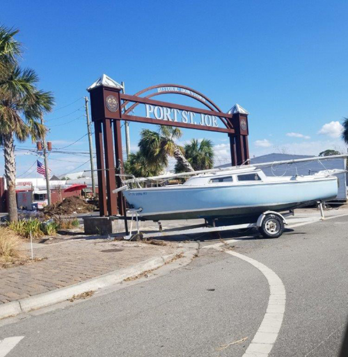 A boat and its trailer were pushed into a sign for Port St. Joe's Historic Downtown, revealing the power of Hurricane Michael, a Category 5 storm that slammed into the Florida Panhandle Oct. 10.