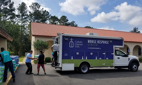 Catholic Charities staff from Miami helped establish a new distribution center in the town of Quincy, a rural area where some 99 percent of the population are Hispanic farmworkers and other undocumented or seasonal laborers.