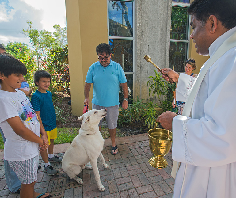 Father George Packuvettithara, St. Rose of Lima pastor, blesses