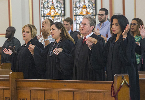 From left: Circuit Court Judges Maria Sampedro-Iglesia, Monica Gordo, John Thornton and Beatrice Butchko recite "The Lord's Prayer."