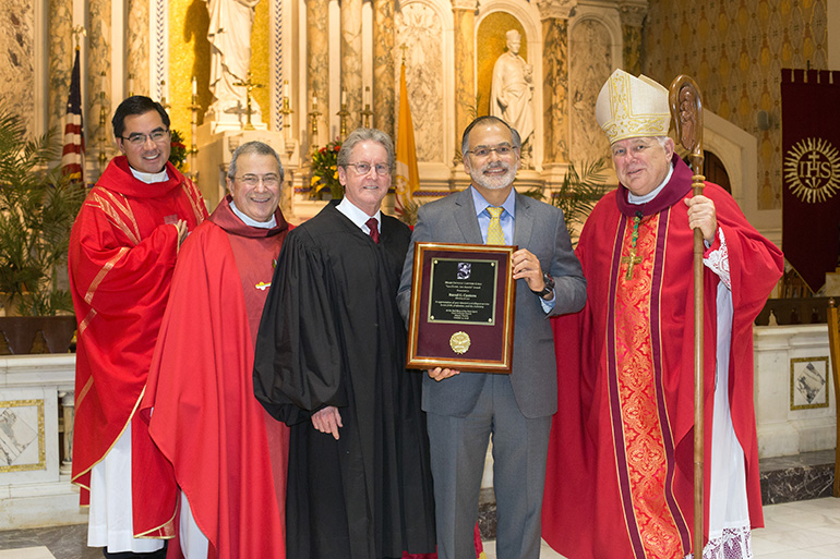 Lex Christi, Lex Amoris award recipient Justice Raoul Cantero poses with Archbishop Thomas Wenski and priests who concelebrated the Red Mass: far left, Father Philip Tran, University of Miami Catholic Student Ministry chaplain and Msgr. Tomas Marin, pastor of St. Augustine Church in Coral Gables and Miami Catholic Lawyers Guild chaplain, as well as Circuit Court Judge John Thornton, last year's honoree.