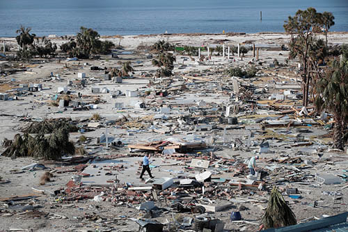 A man walks through a beachfront neighborhood that was decimated by Hurricane Michael on October 16, 2018 in Mexico Beach, Florida. The neighborhood, which had homes most of the way to the beach before the storm, is now mostly flattened. Hurricane Michael slammed into the Florida Panhandle on October 10, as a category 4 storm, claiming at least 19 lives and causing massive damage.  (Getty Images)