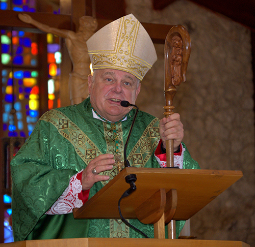 Archbishop Thomas Wenski preaches at the archdiocese’s 60th anniversary Mass at Nativity Church in Hollywood. Following the Mass was a special picnic, festival and concert on church grounds.