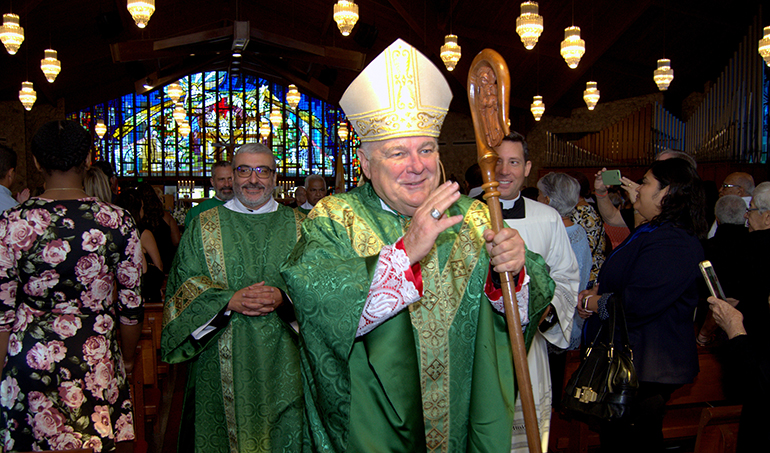 Archbishop Thomas Wenski exist Nativity Church at the end of Mass for the archdiocese’s 60th anniversary. Following the Mass was a special picnic, festival and concert on church grounds.