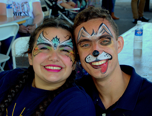 Jane Negreira and Danny Mato compare the archdiocesan Encuentros Juveniles ministry, in which they are leaders, to the archdiocese's 60th anniversary picnic at Nativity Church in Hollywood.