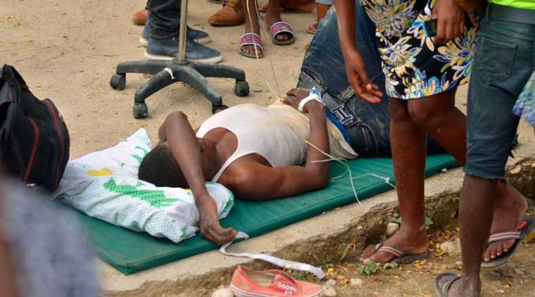 One of the victims of the Oct. 6 earthquake in Haiti is tended to outdoors. So far the death toll is 15 dead, 333 injured, and 7,000 homes destroyed.